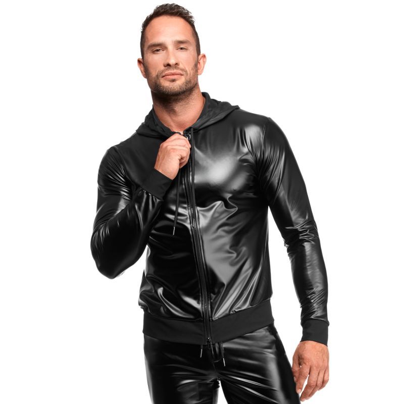 Man wearing a black shiny jacket and pants on a white background