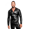 Man wearing a black shiny jacket and pants on a white background